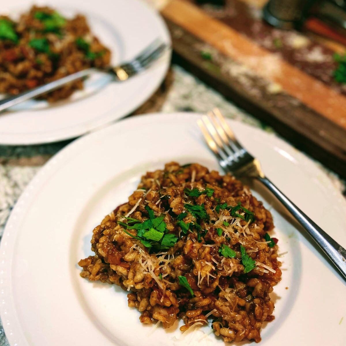 risotto with ragu on plates